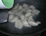 A picture of step 24 of Two Ways to Make Red Yeast Cabbage and Yellow Chive Dumplings (Boiled Dumplings + Potstickers).