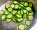 A picture of step 1 of Karela Subzi (Bitter Gourd).