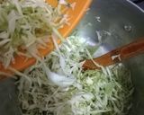 A picture of step 15 of Tumeric rice with sausages, egg curry and salad.