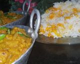 A picture of step 8 of Dam allu with colourful zeera rice.