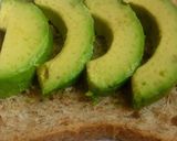 A picture of step 3 of Avocado toast with poppy seeds.