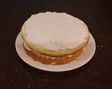 A picture of step 29 of White Layer Cake with a Raspberry Swirl Cheesecake center layer and a Raspberry Cream Frosting.