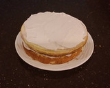 A picture of step 29 of White Layer Cake with a Raspberry Swirl Cheesecake center layer and a Raspberry Cream Frosting.