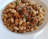 Foto del paso 7 de la receta Alubias con butifarra con salsa de parmesano y albahaca