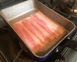 A picture of step 2 of Egg-in-a-Hole Bacon Toast.