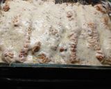 A picture of step 8 of Chicken Enchiladas (white sauce).