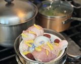 A picture of step 4 of Steamed Herbal Chicken.