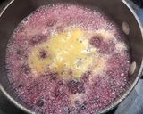 A picture of step 7 of Lemon Pepper Chicken with a Blueberry Orange Wine Sauce.