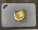 Foto del passaggio 5 della ricetta Sfogliatine con budino alla vaniglia ananas e amaretti