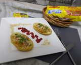 A picture of step 8 of Maggi stuffed jacket potatoes.