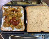 A picture of step 1 of Chole bread sandwich with masala chai and cucumber.