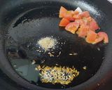 A picture of step 1 of Potato Peas Curry or Aloo Matar.