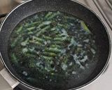 A picture of step 7 of Ocean Blue Pasta with Toasted Pine Nuts and Parmesan.