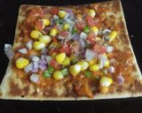 A picture of step 4 of Corn Capsicum Pizza.