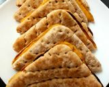 A picture of step 6 of My Melted Cheese & Red Onion Toasted Thins.🥰.