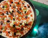 A picture of step 4 of Chicken tikkka pizza.