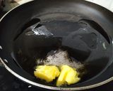 A picture of step 1 of Banana Sooji Halwa.