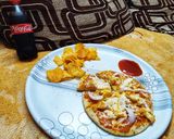 A picture of step 8 of Paneer Pizza.