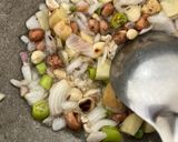 A picture of step 2 of Potato Peas Onion Poha.