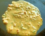 A picture of step 3 of Besan Chila with veggies.