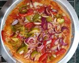 A picture of step 11 of Capsicum Onion Cheese Pizza.