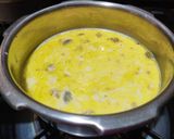A picture of step 4 of Doodh daliya in pressure cooker (with different toppings).