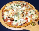A picture of step 9 of Cheese Burst Veggies And Chicken Pizza From Scratch.