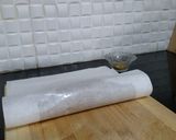 A picture of step 9 of Biscuits Meethi (Swiss roll style).
