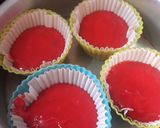 A picture of step 2 of Red cup cakes with chocolate center.