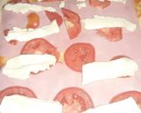 Foto del paso 3 de la receta: Enrollado a la pizza relleno con jamón, queso y tomate