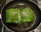 A picture of step 12 of Paneer wrapped in banana leaf.