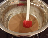 A picture of step 3 of Chocolate Layer Cake with Strawberry Cream Filling, White Chocolate Ganache Frosting coated with a Chocolate Crumble.