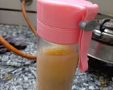 A picture of step 3 of Orange mint juice.