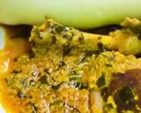 A picture of step 10 of Egusi soup and rolled up pounded yam.