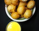 A picture of step 14 of Coconut puff puff and costard.