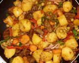 A picture of step 6 of Veggies fried irish potatoe.