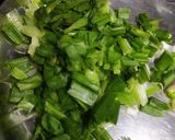 A picture of step 8 of Baingan bharta with spring onion.