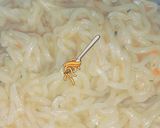 A picture of step 2 of Knorr chicken noodles.