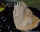 A picture of step 12 of ِDough fried pizza.