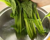 A picture of step 3 of Blanched spinach with sesame dressing.