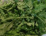 A picture of step 1 of Carrot-Top and Spinach Wilted Salad.