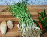 A picture of step 1 of Green garlic, green chilli ginger pickle.