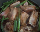 A picture of step 6 of Braised Pork Ribs with Onions.