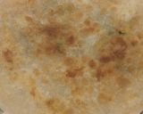 A picture of step 4 of Alu paratha with desi ghee.