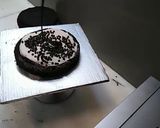 A picture of step 4 of 8 inch tall chocolate brownie cake.