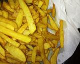 A picture of step 5 of Chips masala, wetfry beef with sausages.