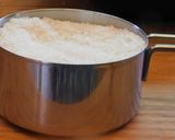 A picture of step 3 of Sweet Puttu (steamed rice cake from Kerala) with coconut.