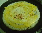 A picture of step 2 of Egg Dosa.