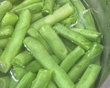 Hình bước làm 3 của món Cơm nhà với canh sườn rau muống nấu sấu, ngô chiên bơ rong biển vụn, đậu cove luộc rắc mè, chả mực