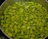 A picture of step 1 of Gawar aani Batata Upkari.